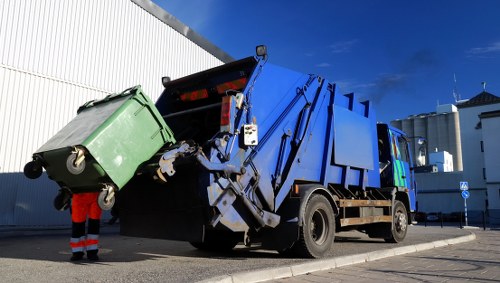 Business professionals handling waste in North West London office